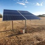 Six panel ground-mounted solar array on Clenergy SolarTerrace II-A post mount in rural setting