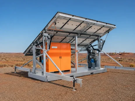 Hybrid solar power skid with deployed solar panels at a remote Western Australian mining site.